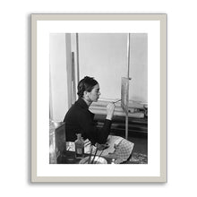 Frida painting Self-Portrait on the Borderline between Mexico and the United States by unknown photographer