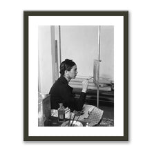 Frida painting Self-Portrait on the Borderline between Mexico and the United States by unknown photographer